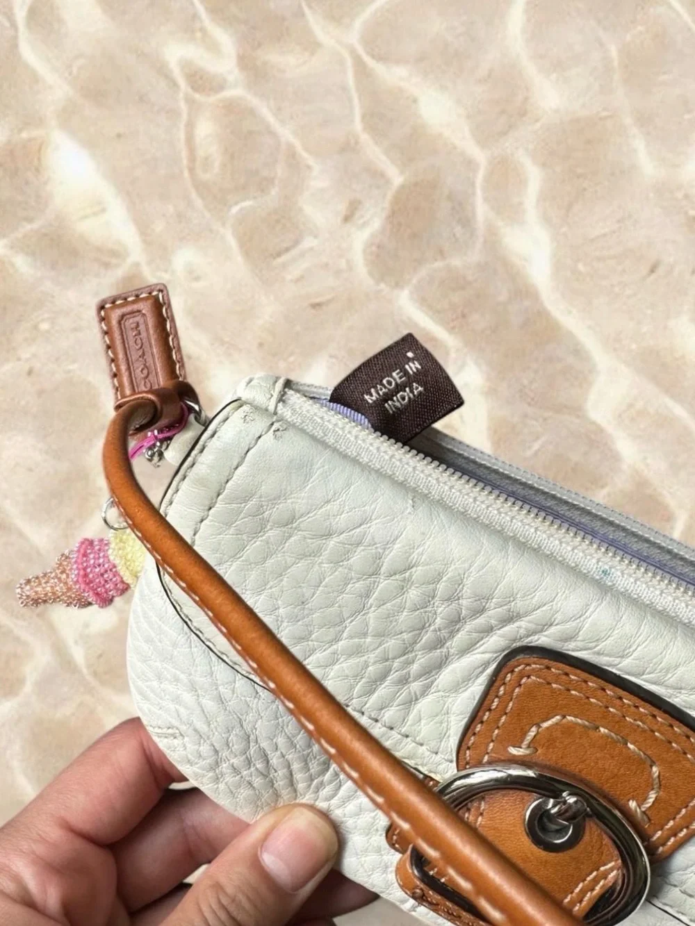 Coach Soho White Pebbled Leather Wristlet Wallet with Tan Buckle Accent
